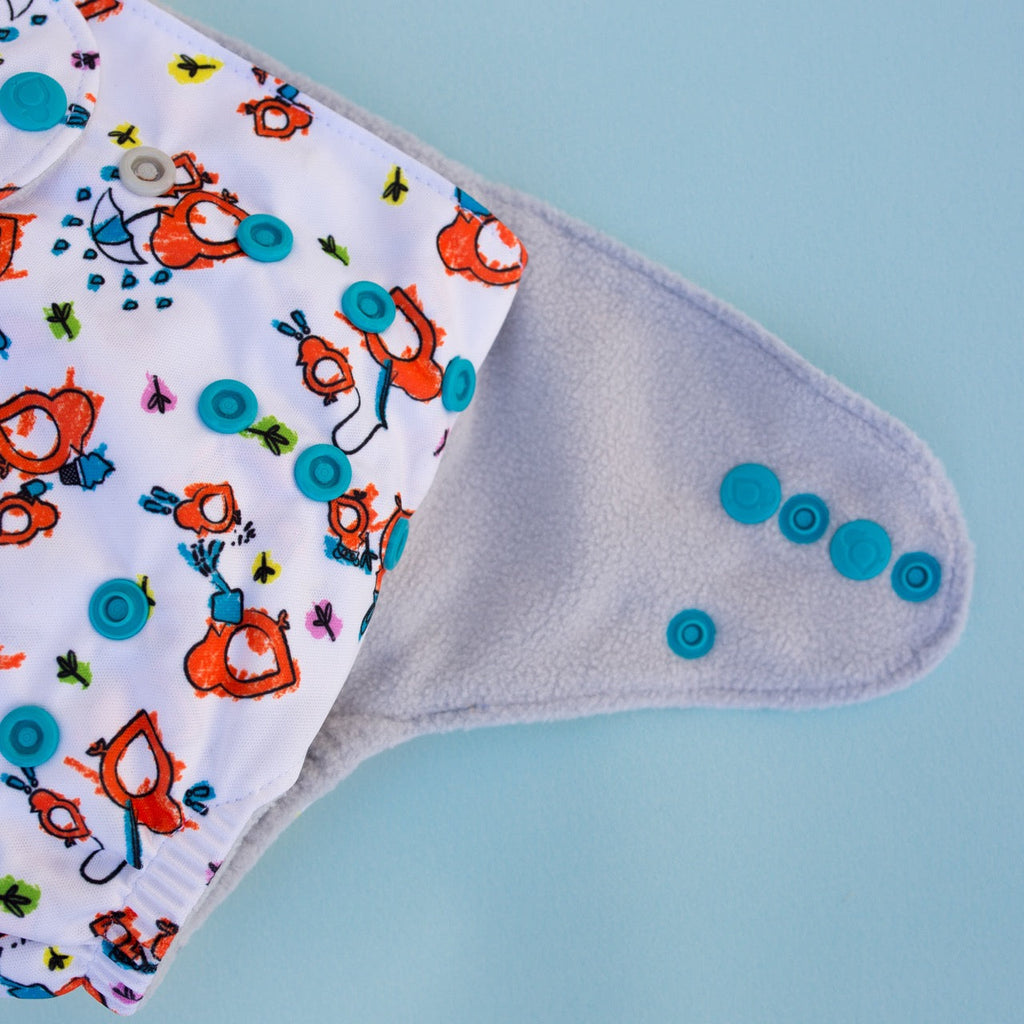 What’s with all the SNAPS?! How does a one size cloth diaper fit?