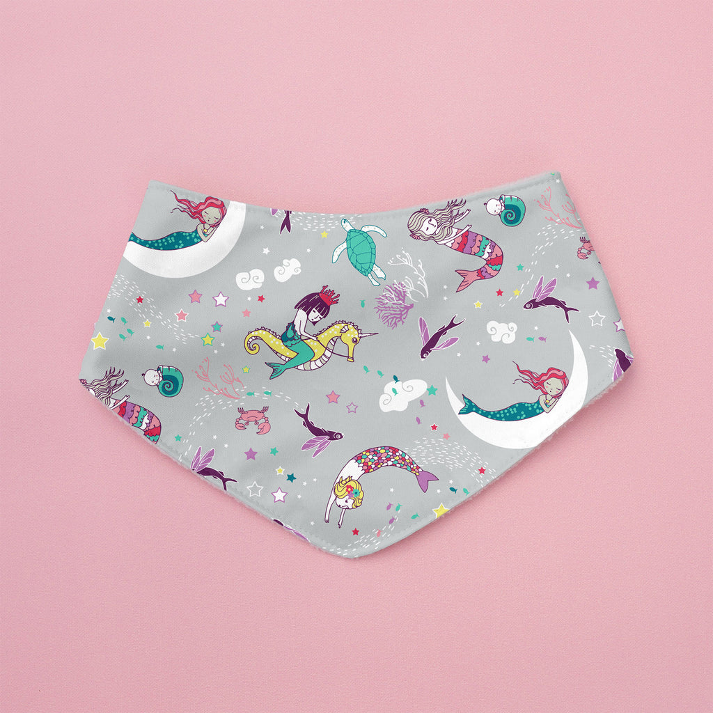 Fabric with mermaid pattern on a pink background